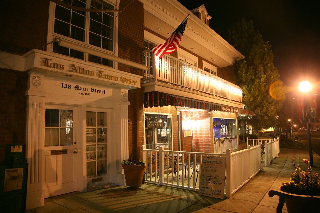 The Los Altos Town Crier building on Main Street, lit at night