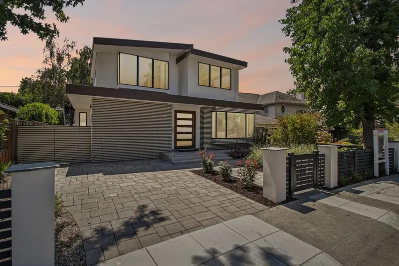 2280 St. Francis Drive at dusk — the front elevation, entry court and new planting
