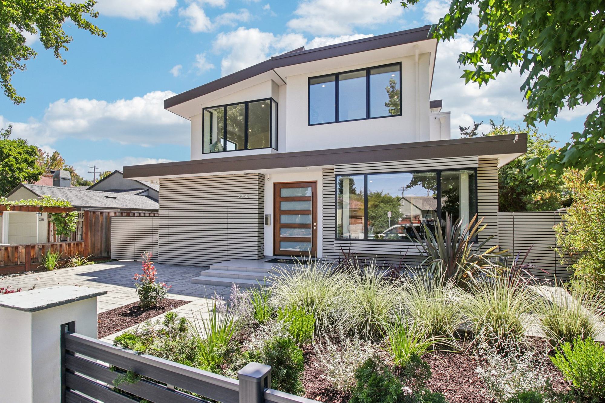 2280 St. Francis Drive in daylight — the front elevation under a clear sky, new planting along the entry