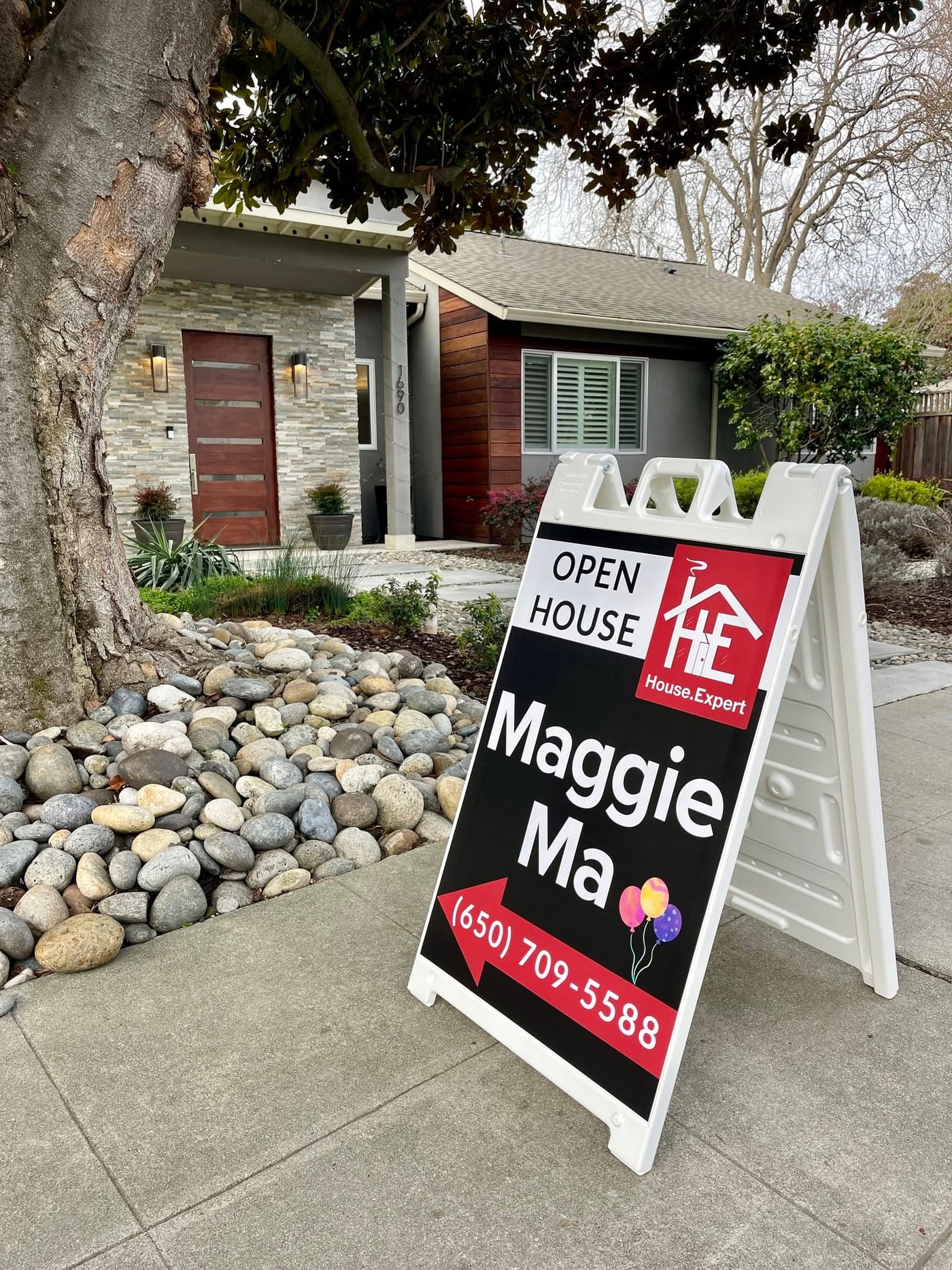 Maggie Ma’s House.Expert open-house sign on the pavement outside 1690 Edgewood Drive, the front door of the house behind it