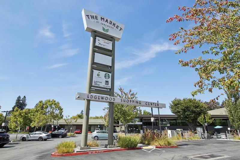 The pylon sign for The Market at Edgewood above the tenant board at Edgewood Shopping Center, Palo Alto
