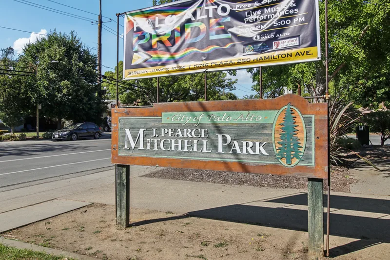 The wooden City of Palo Alto sign for J. Pearce Mitchell Park at the roadside on Middlefield Road